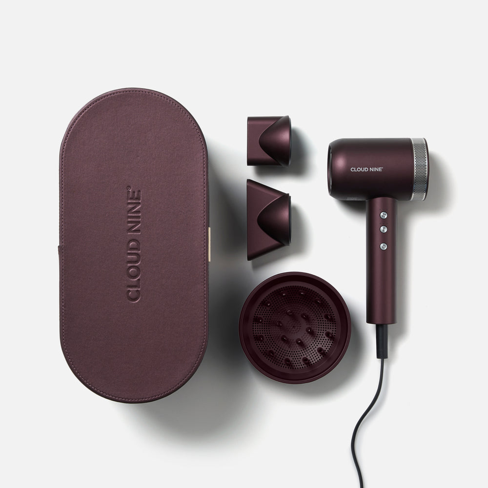 The Dark Burgundy Airshot Pro dryer set with two magnetic attachments, a diffuser, and carrying case on a white background, branded 'Cloud Nine'.