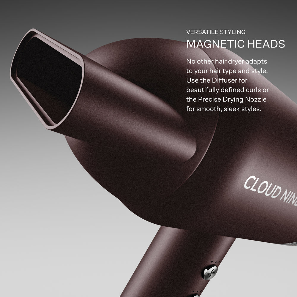 The Dark Burgundy Airshot Pro hair dryer with magnetic heads and 'Cloud Nine' branding on a grey background. 'Versatile styling, magnetic heads. No other hair dryer adapts to your hair type and style. Use the Diffuser for beautifully defined curls or the Precise Drying Nozzle for smooth, sleek styles'.
