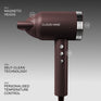 Dark Burgundy Airshot Pro hair dryer with features labeled on a grey background. Magnetic heads, self-clean technology, and personalised temperature control.