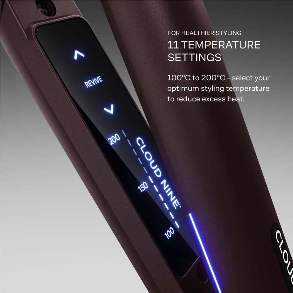 The Original Iron pictured with a lit up digital display, featuring temperature settings from 100 to 200 degrees celsius on a gradient grey background. 'Select your optimum styling temperature to reduce excess heat.'