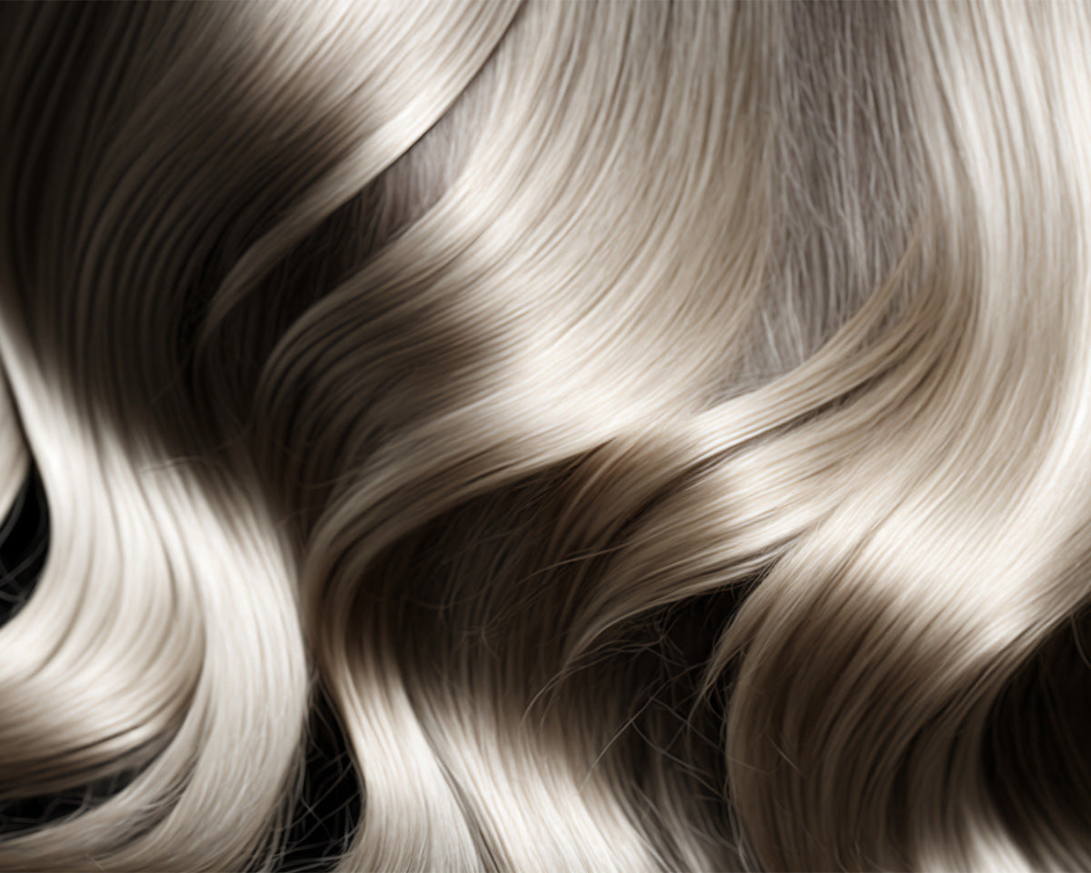 A close-up image of wavy blonde hair.