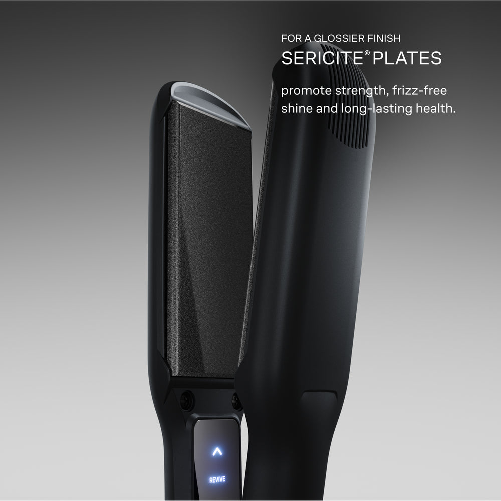 The Wide Iron for professionals in Black with Sericite plates displayed on a grey background. For a glossier finish, Sericite plates promote strength, frizz-free shine, and long-lasting health.